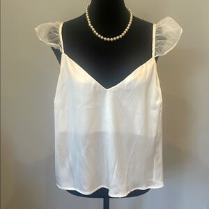 Elegant White Sleeveless Top low neck satin looks